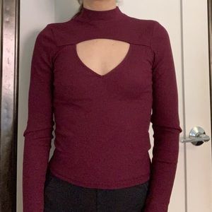 Long sleeve mock neck shirt with cut out